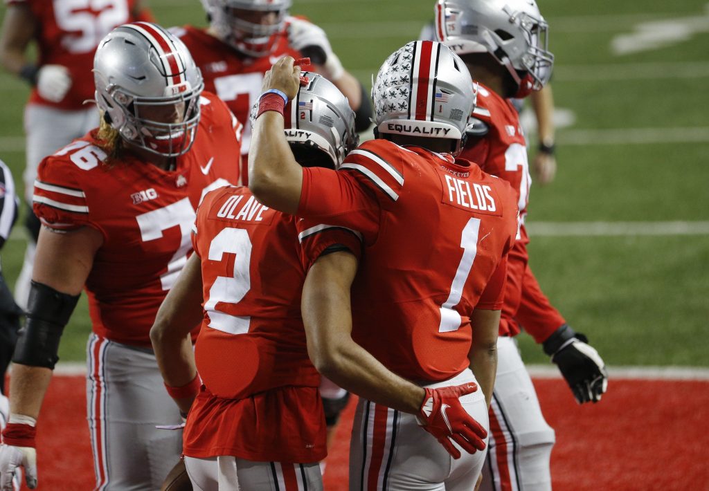 Ohio State quarterback Justin Fields celebrates with teammates after throwing touchdown during win over Rutgers