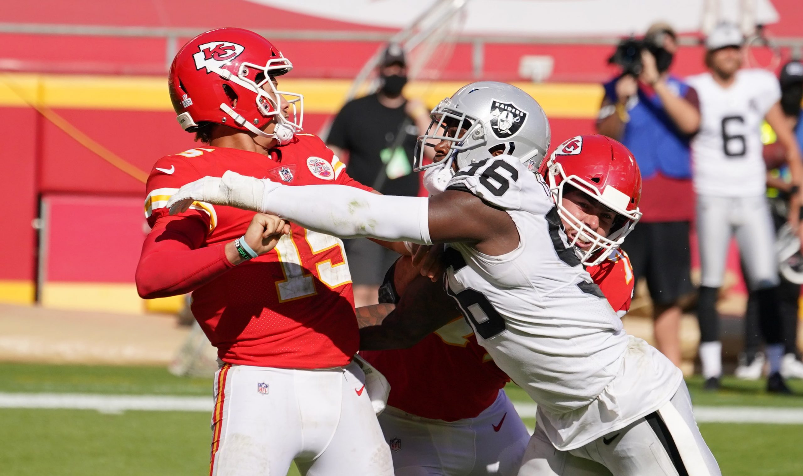 Kansas City Chiefs quarterback Patrick Mahomes is hit by Las Vegas Raiders defensive lineman Clelin Ferrell