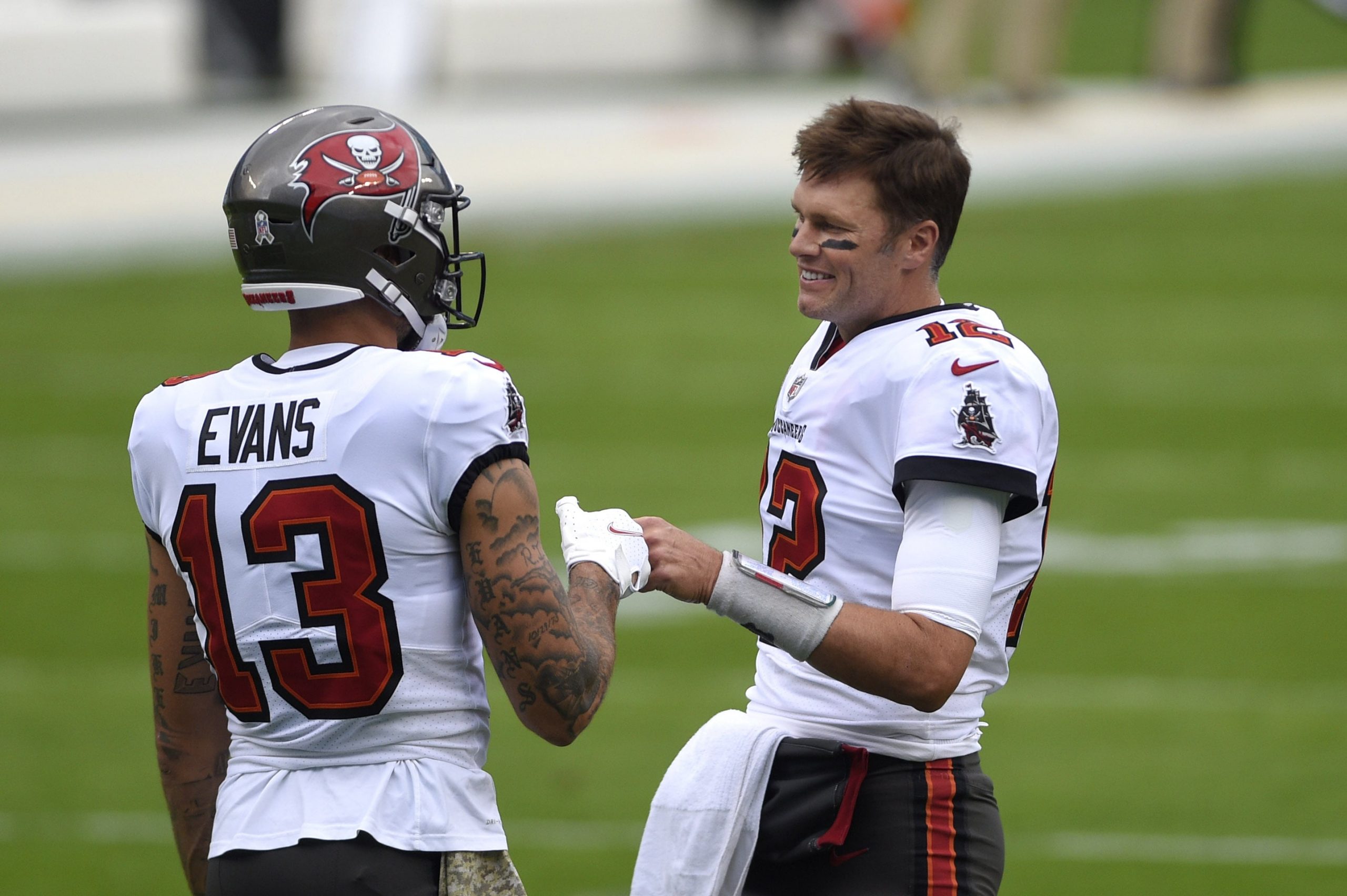 Tampa Bay Buccaneers quarterback Tom Brady talks with receiver Mike Evans before game against Panthers