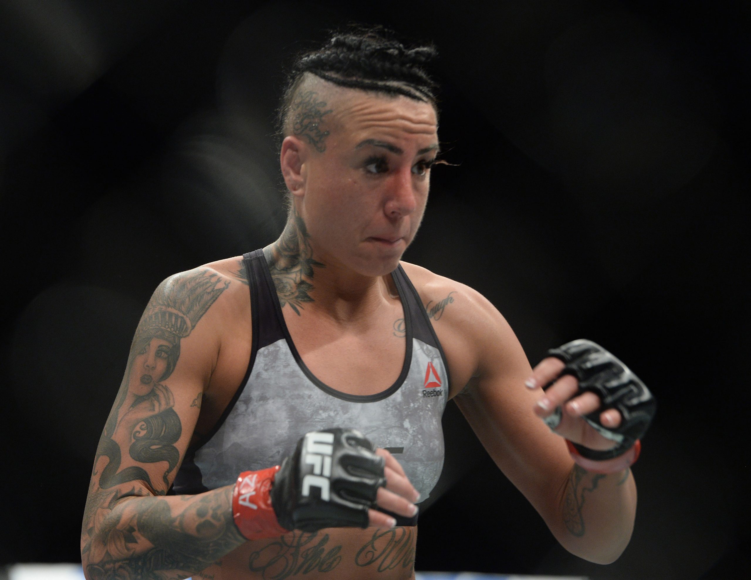 Feb 17, 2019; Phoenix, AZ, USA; Ashlee Evans-Smith (red gloves) and Andrea Lee (blue gloves) fight during their flyweight bout during UFC Fight Night at Talking Stick Resort Arena. Lee won via decision.