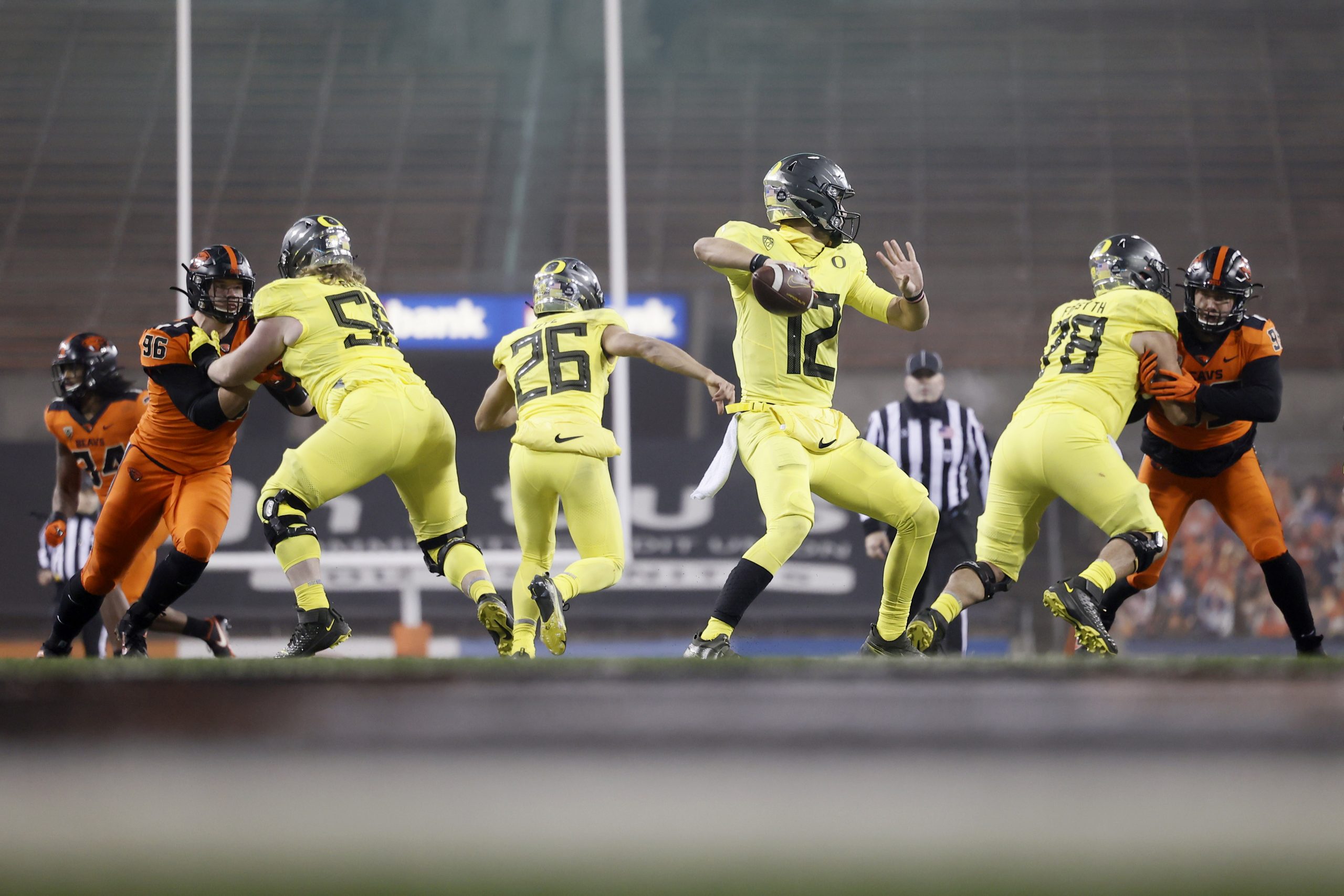 Nov 27, 2020; Corvallis, Oregon, USA; Oregon Ducks quarterback Tyler Shough (12) drops back to throw against the Oregon State Beavers during the second half at Reser Stadium.