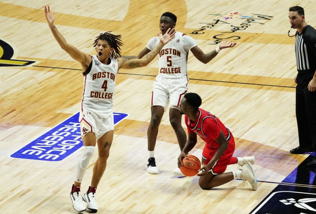 Boston College basketball players argue a call with refs during loss to St. John's