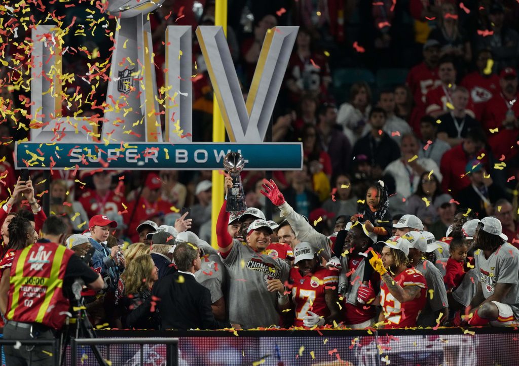 Kansas City Chiefs quarterback Patrick Mahomes (15) hoist the Vince Lombardi Trophy after defeating the San Francisco 49ers in Super Bowl LIV at Hard Rock Stadium.