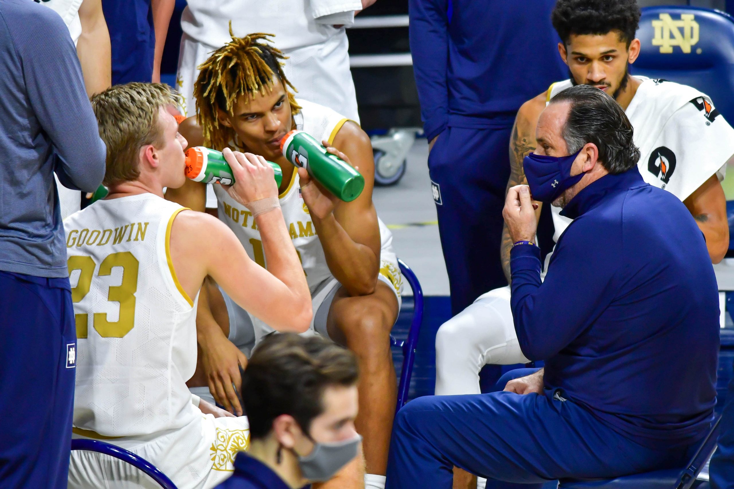 Notre Dame Fighting Irish head coach Mike Brey talks to players during timeout in game against Ohio State