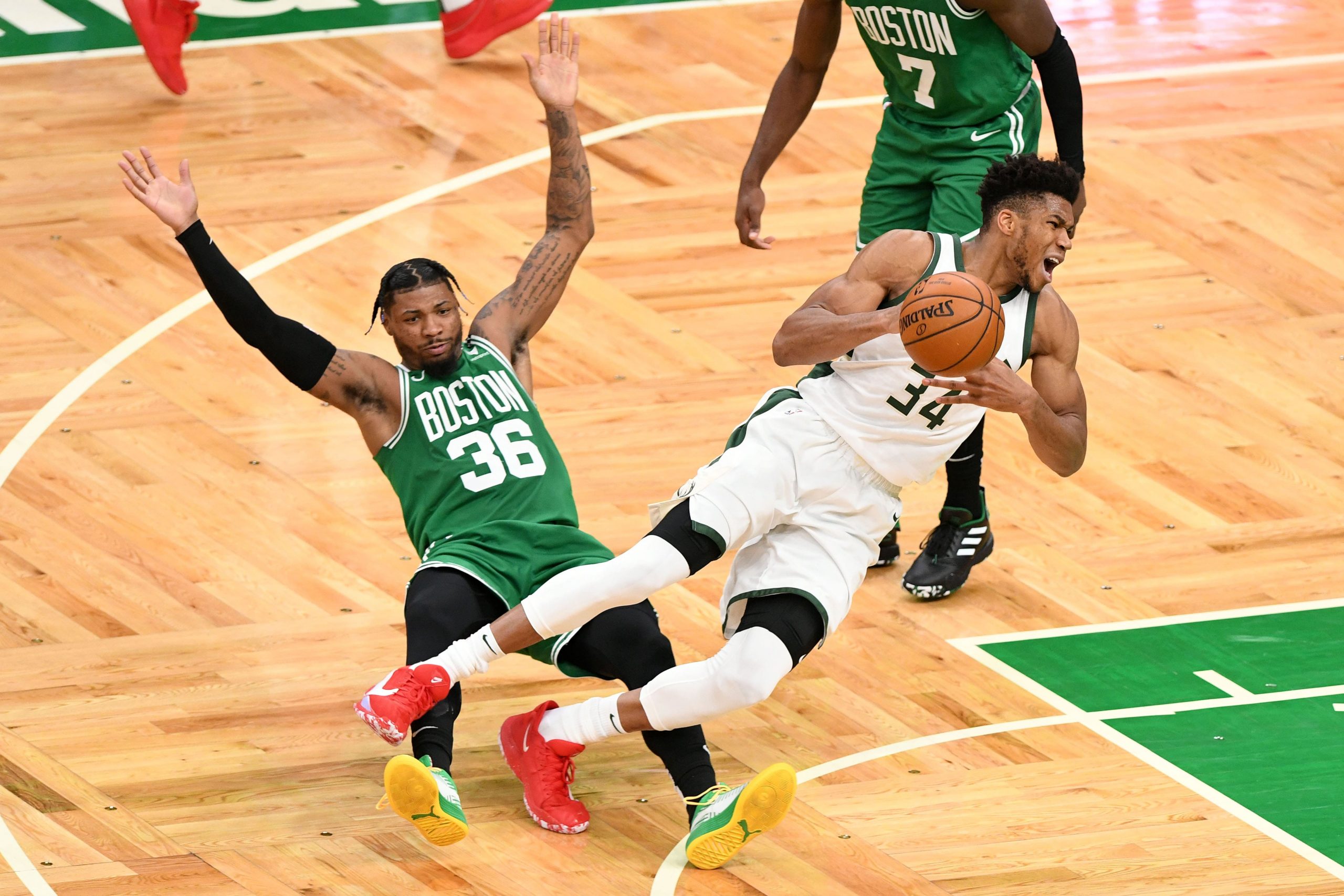 Giannis Antetokounmpo takes a tumble