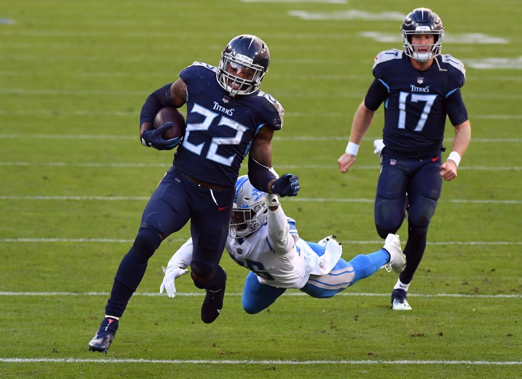 Tennessee Titans running back Derrick Henry (22) runs away from Detroit Lions strong safety Duron Harmon (26) during the second half at Nissan Stadium.