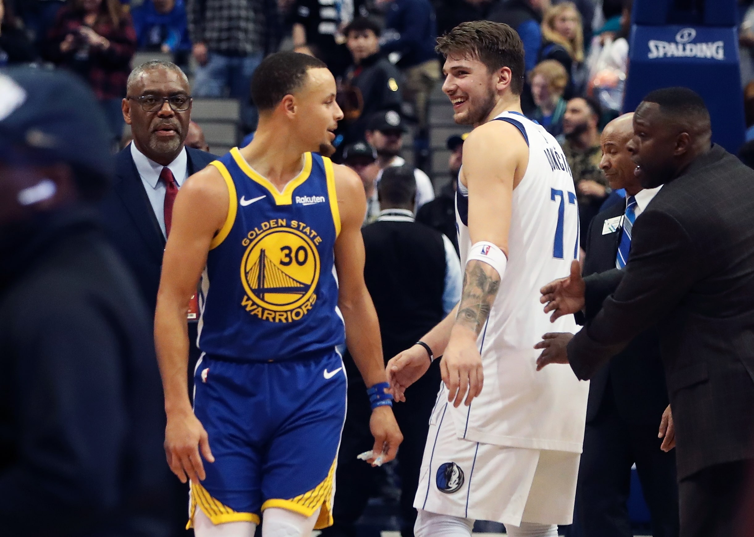 Golden State Warriors guard Stephen Curry and Dallas Mavericks guard Luka Doncic talk after game