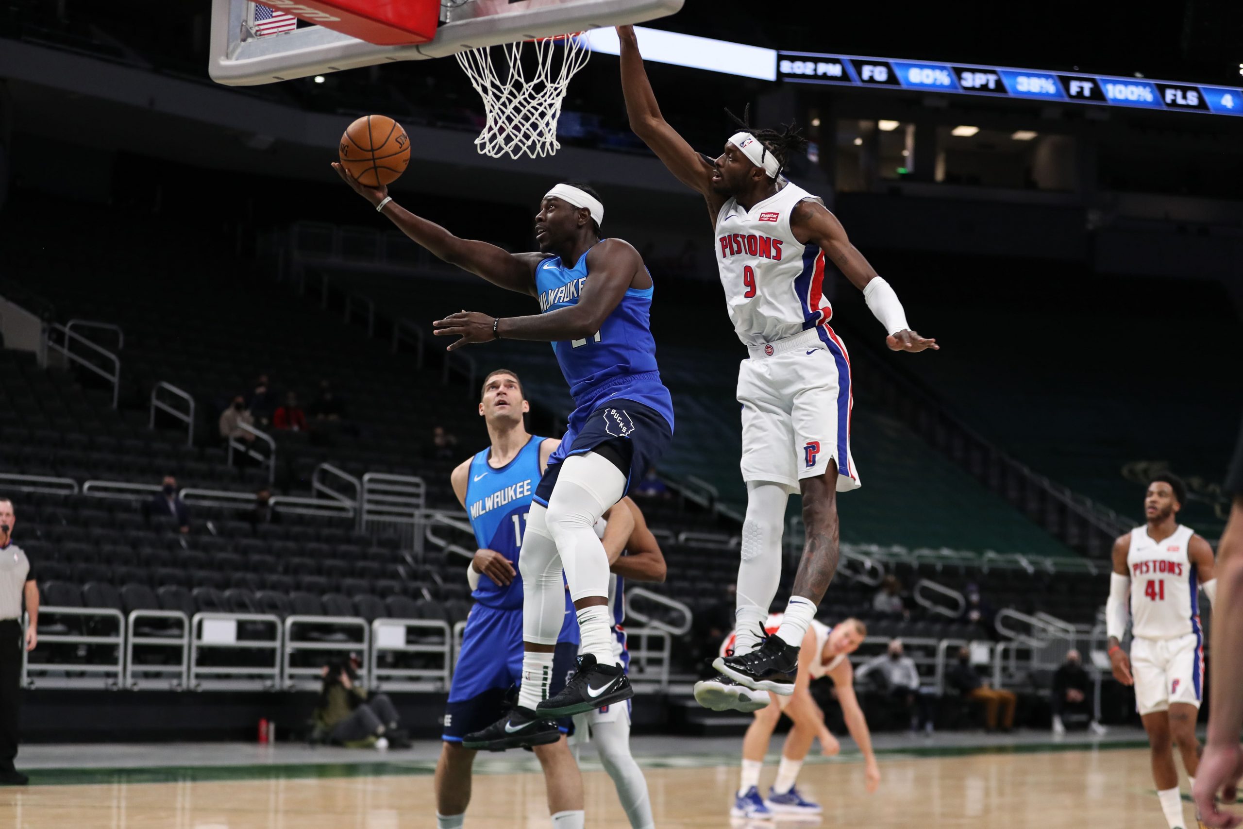 Milwaukee Bucks guard Jrue Holiday (21) shoots against Detroit Pistons forward Jerami Grant (9) at the Bradley Center.