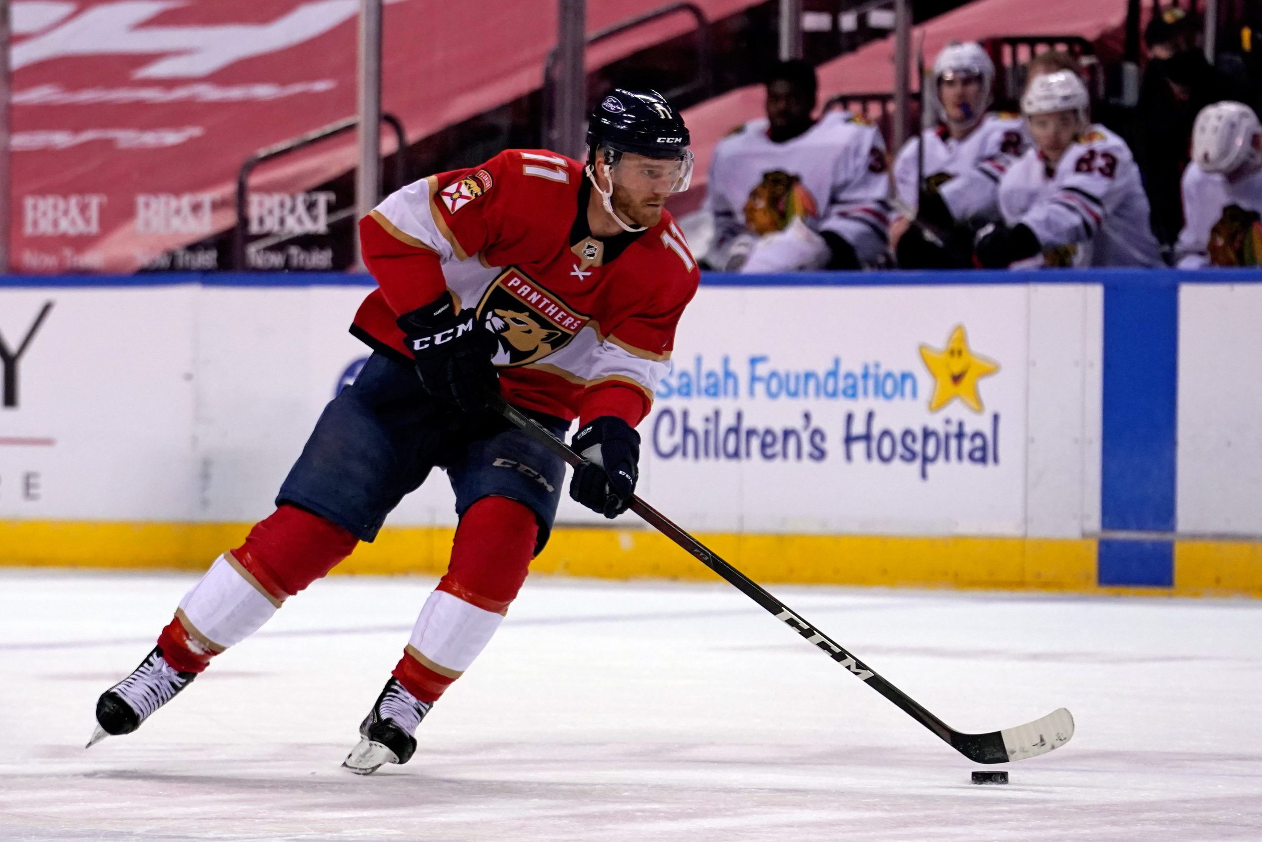 Jan 17, 2021; Sunrise, Florida, USA; Florida Panthers left wing Jonathan Huberdeau (11) skates with the puck during the second period against the Chicago Blackhawks at BB&amp;T Center.