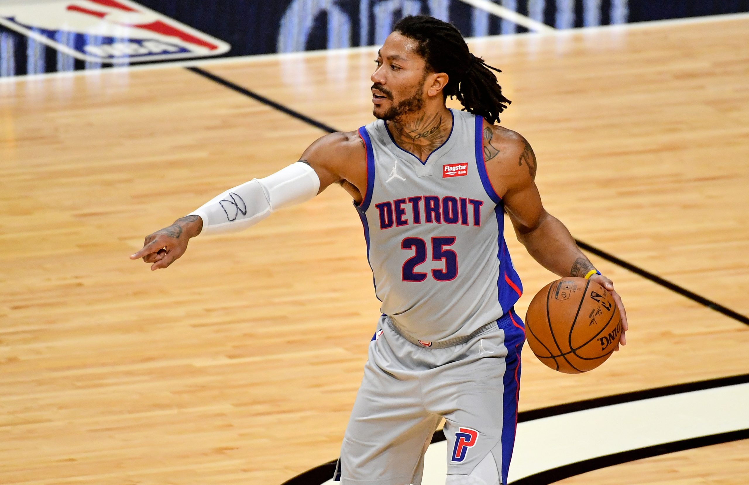 Detroit Pistons guard Derrick Rose (25) controls the ball against the Miami Heat during the first half at American Airlines Arena.