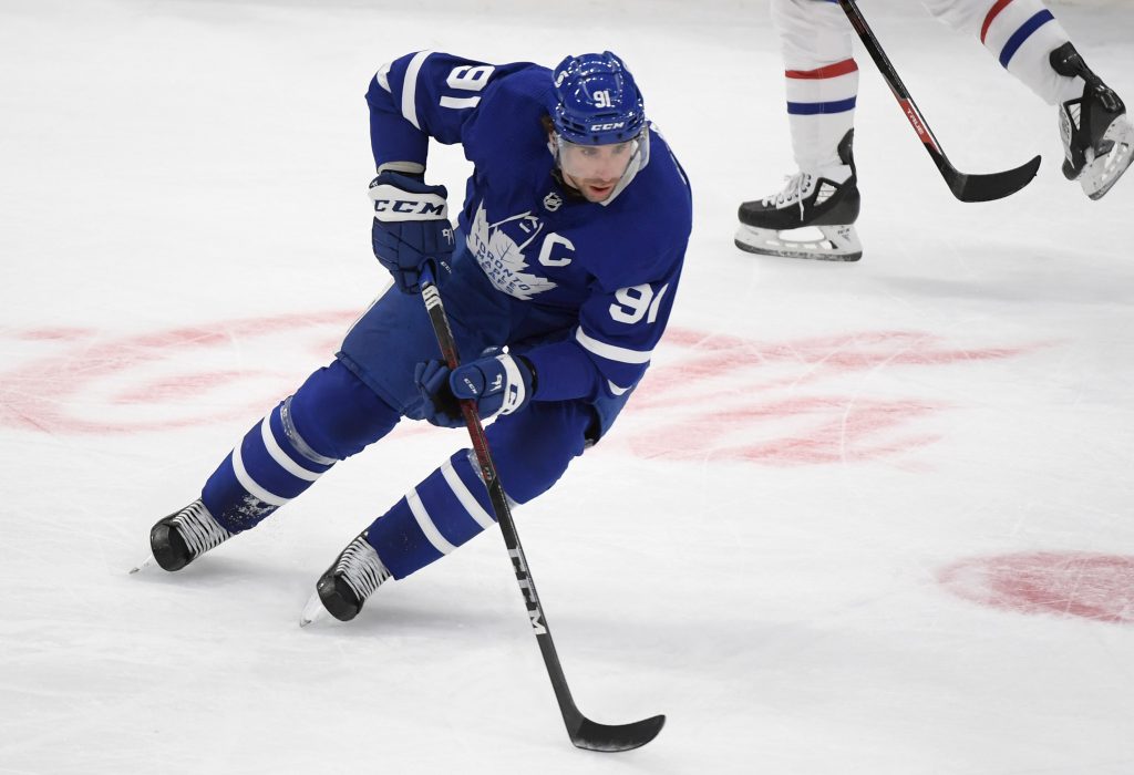 Jan 13, 2021; Toronto, Ontario, CAN; Toronto Maple Leafs center John Tavares (91) skates with the puck against the Montreal Canadiens at Scotiabank Arena.