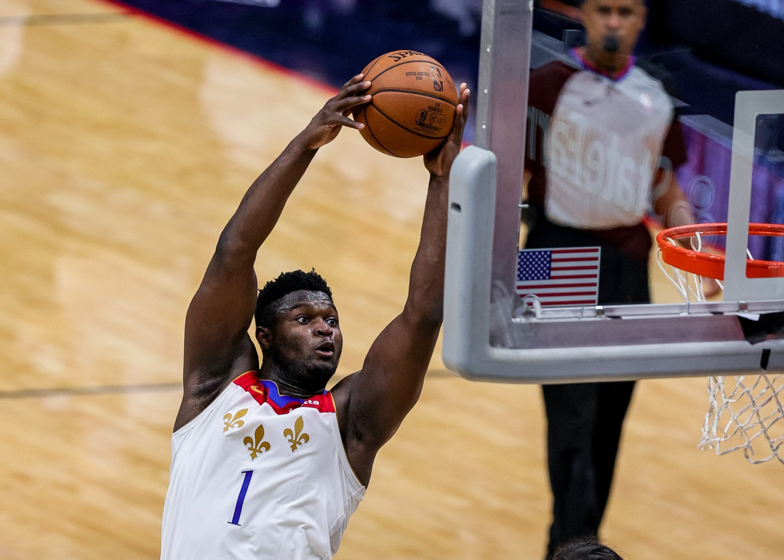 New Orleans Pelicans forward Zion Williamson (1) dunks the ball against Charlotte Hornets guard Terry Rozier (3) during the third quarter at Smoothie King Center.
