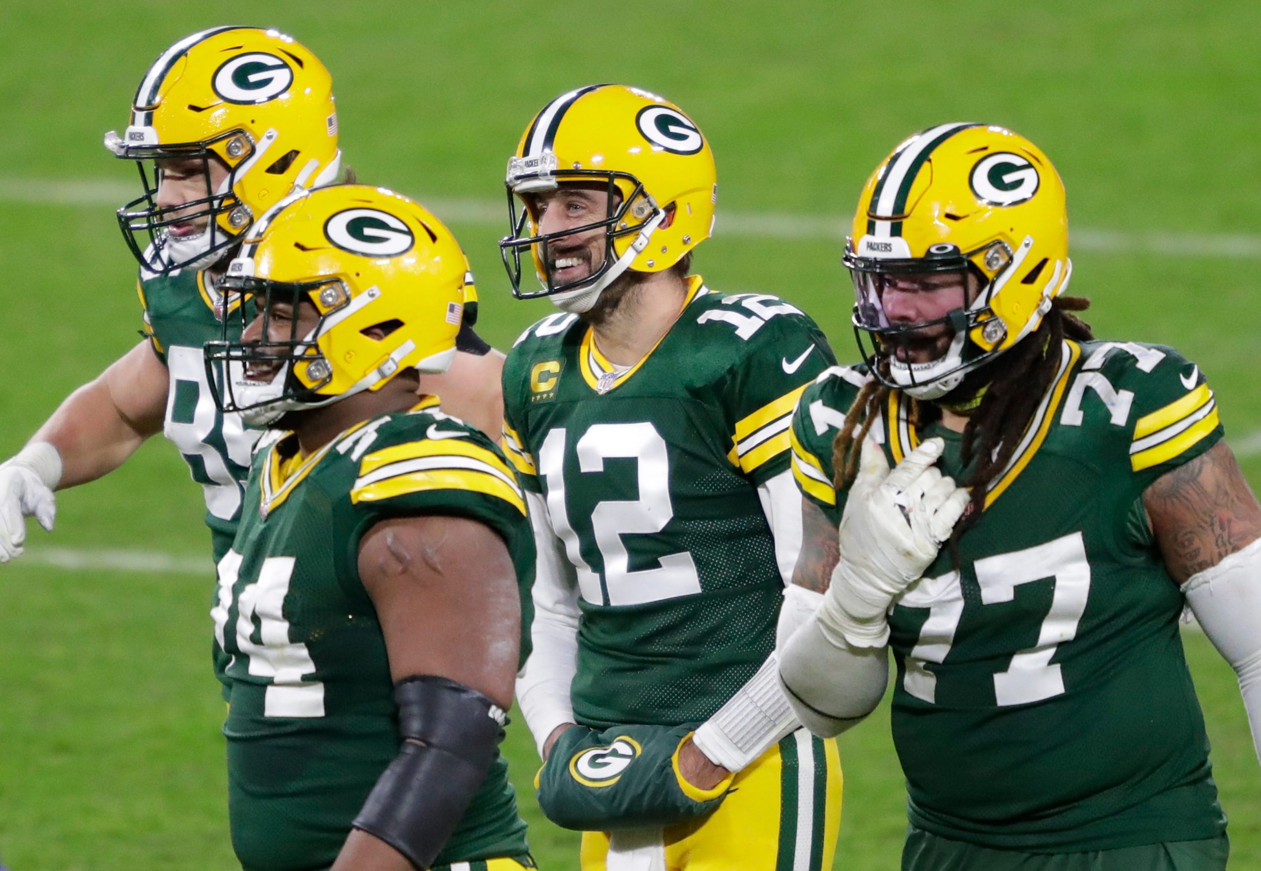 QB Aaron Rodgers (12) and the Packers were all smiles Saturday night after dispatching the Rams.