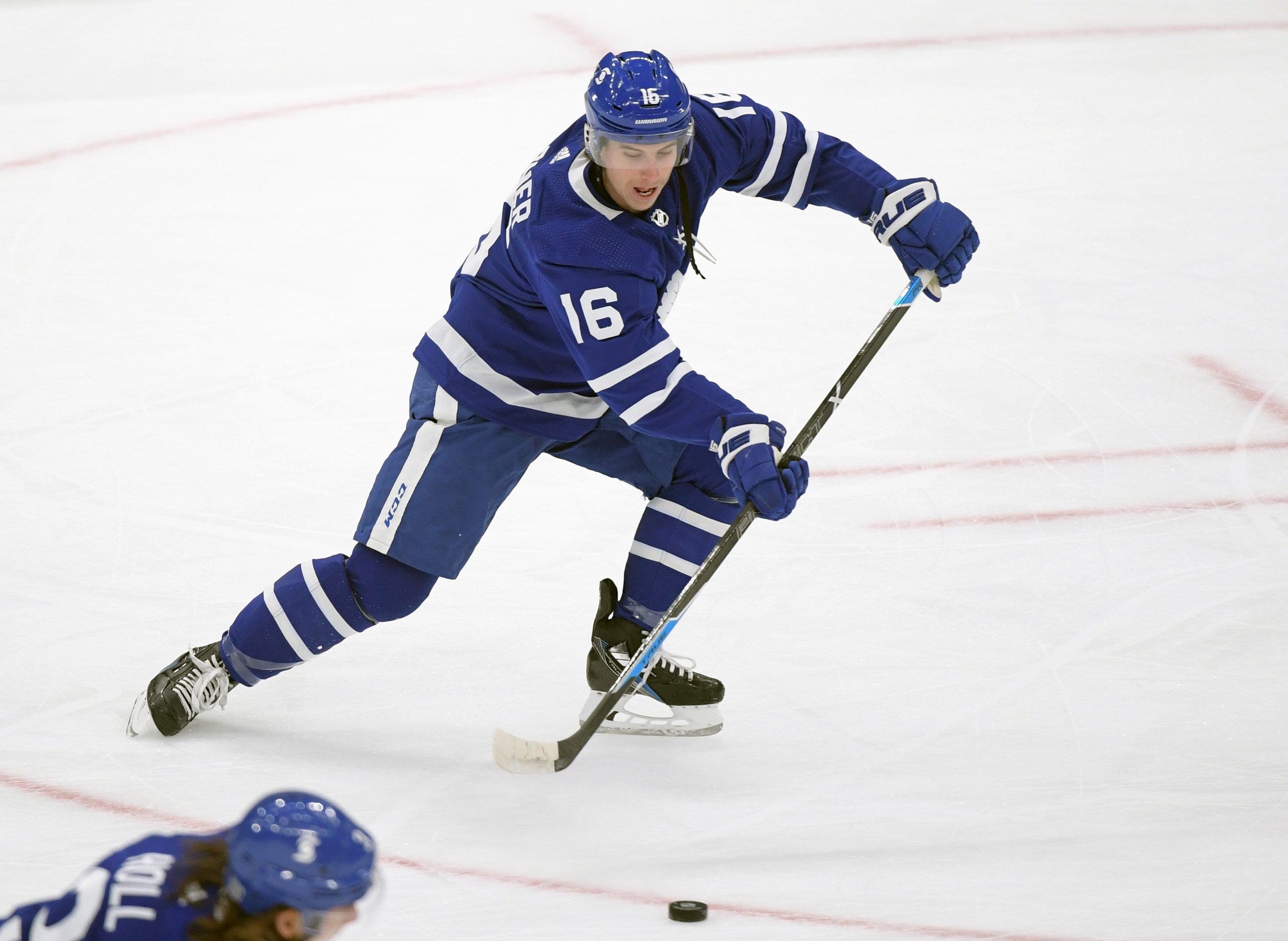 Jan 20, 2021; Toronto, Ontario, CAN; Toronto Maple Leafs forward Mitchell Marner (16) passes the puck during warmup before playing Edmonton Oilers at Scotiabank Arena.