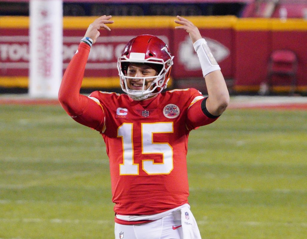 Kansas City Chiefs quarterback Patrick Mahomes (15) celebrates during the fourth quarter in the AFC Championship Game against the Buffalo Bills at Arrowhead Stadium.