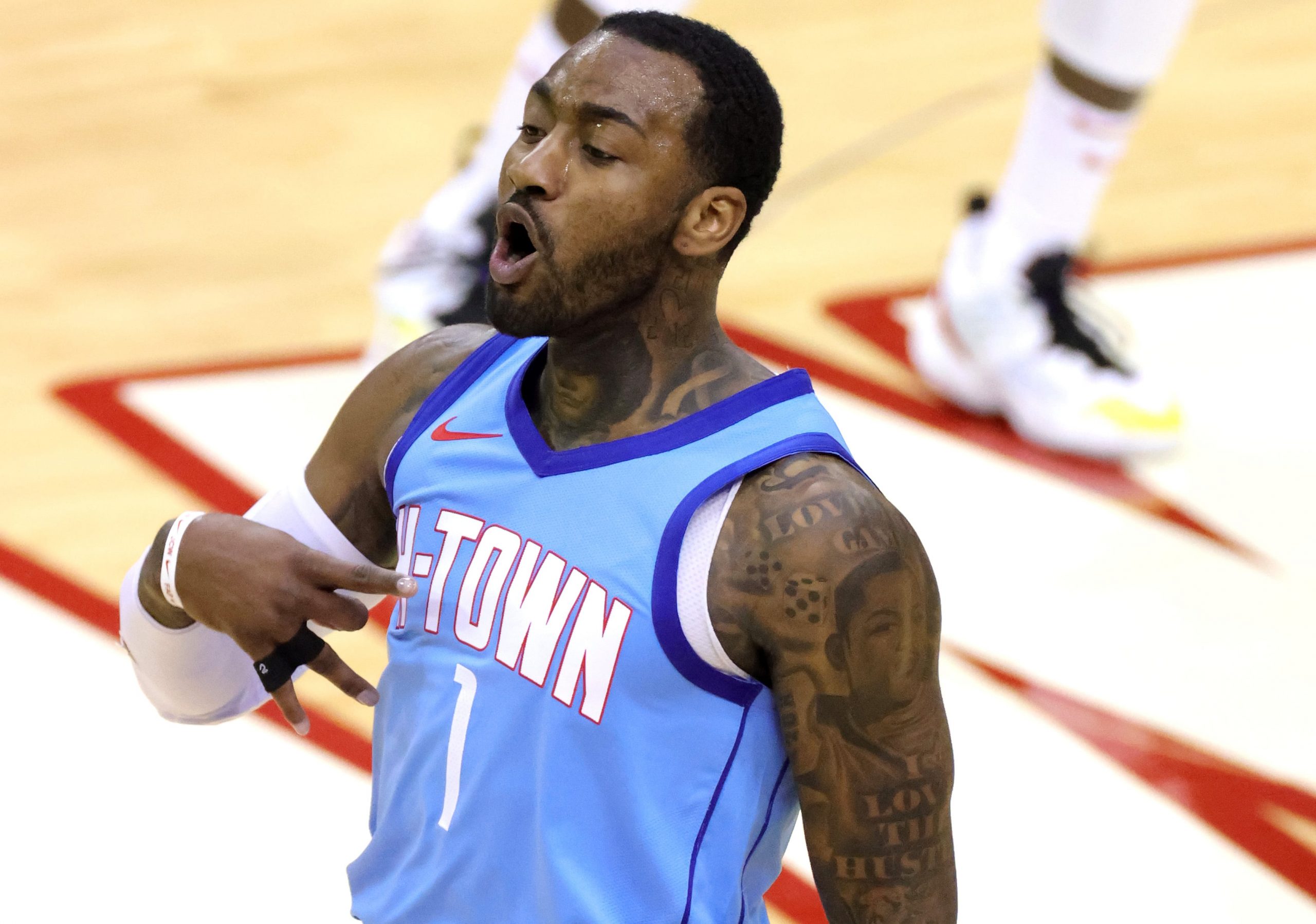 Houston Rockets guard John Wall celebrates making a three-pointer during win over Wizards