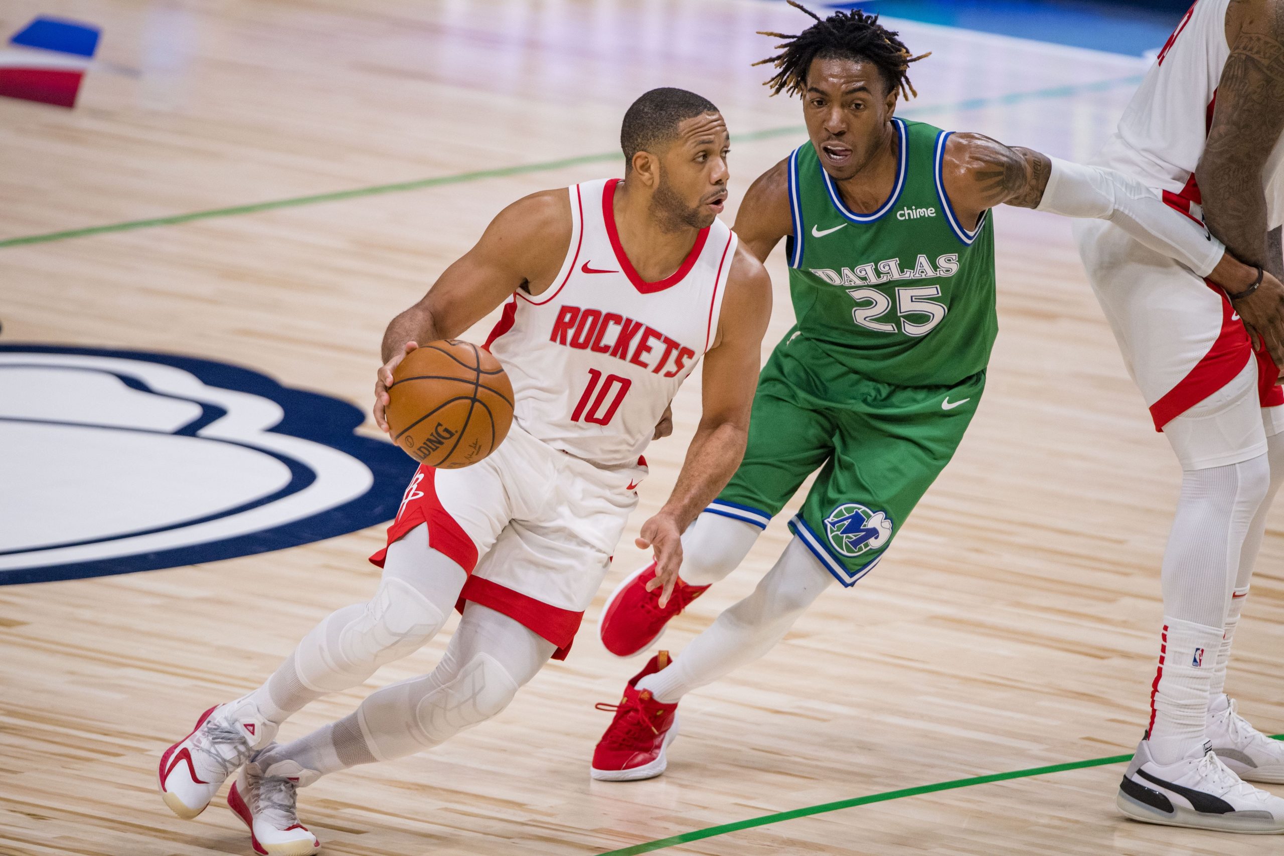 Houston Rockets guard Eric Gordon (10) drives to the basket past Dallas Mavericks forward Wes Iwundu (25) during the second half at the American Airlines Center.