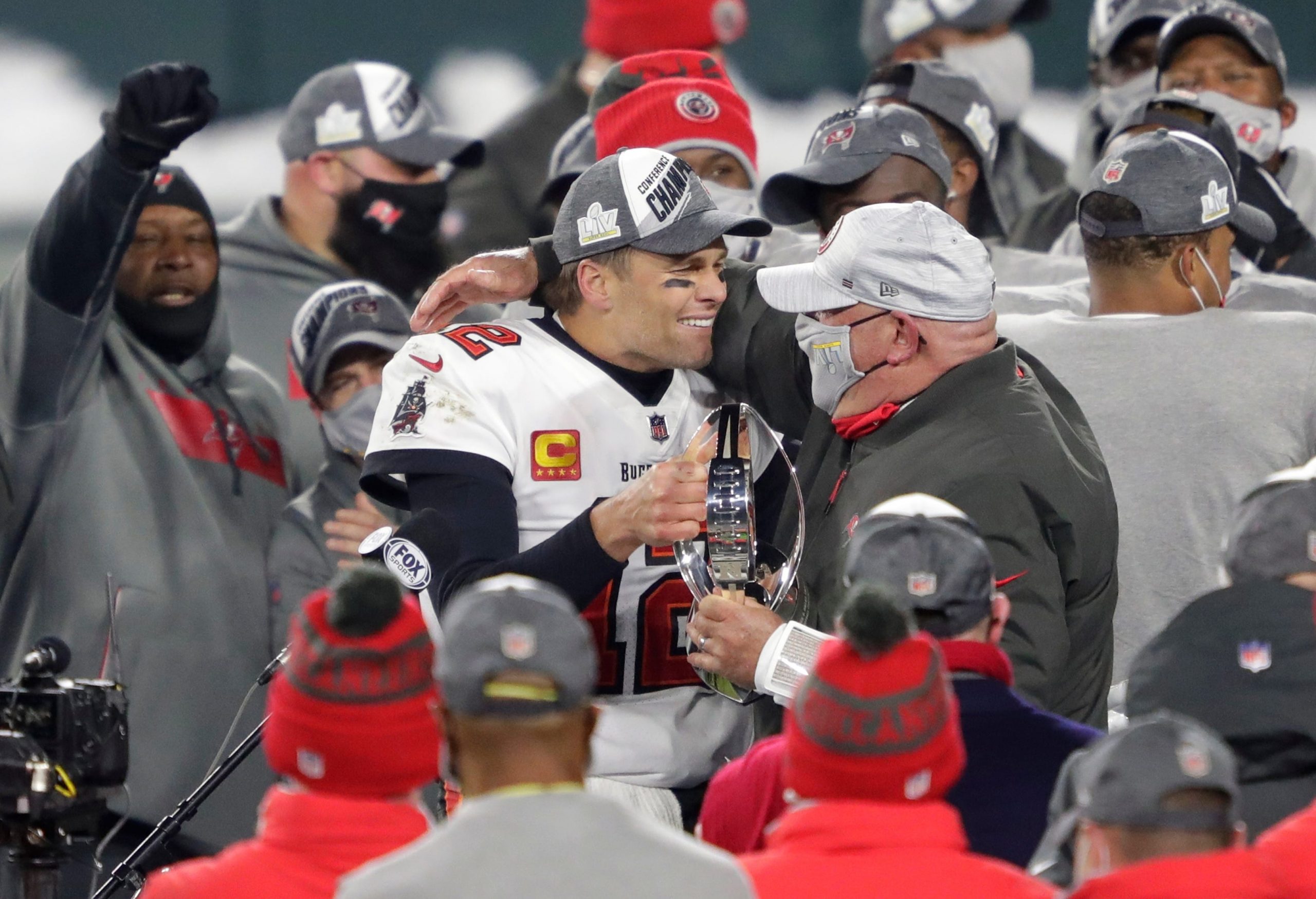 Tampa Bay Buccaneers quarterback Tom Brady and head coach Bruce Arians celebrate win over Green Bay Packers in NFC Championship Game