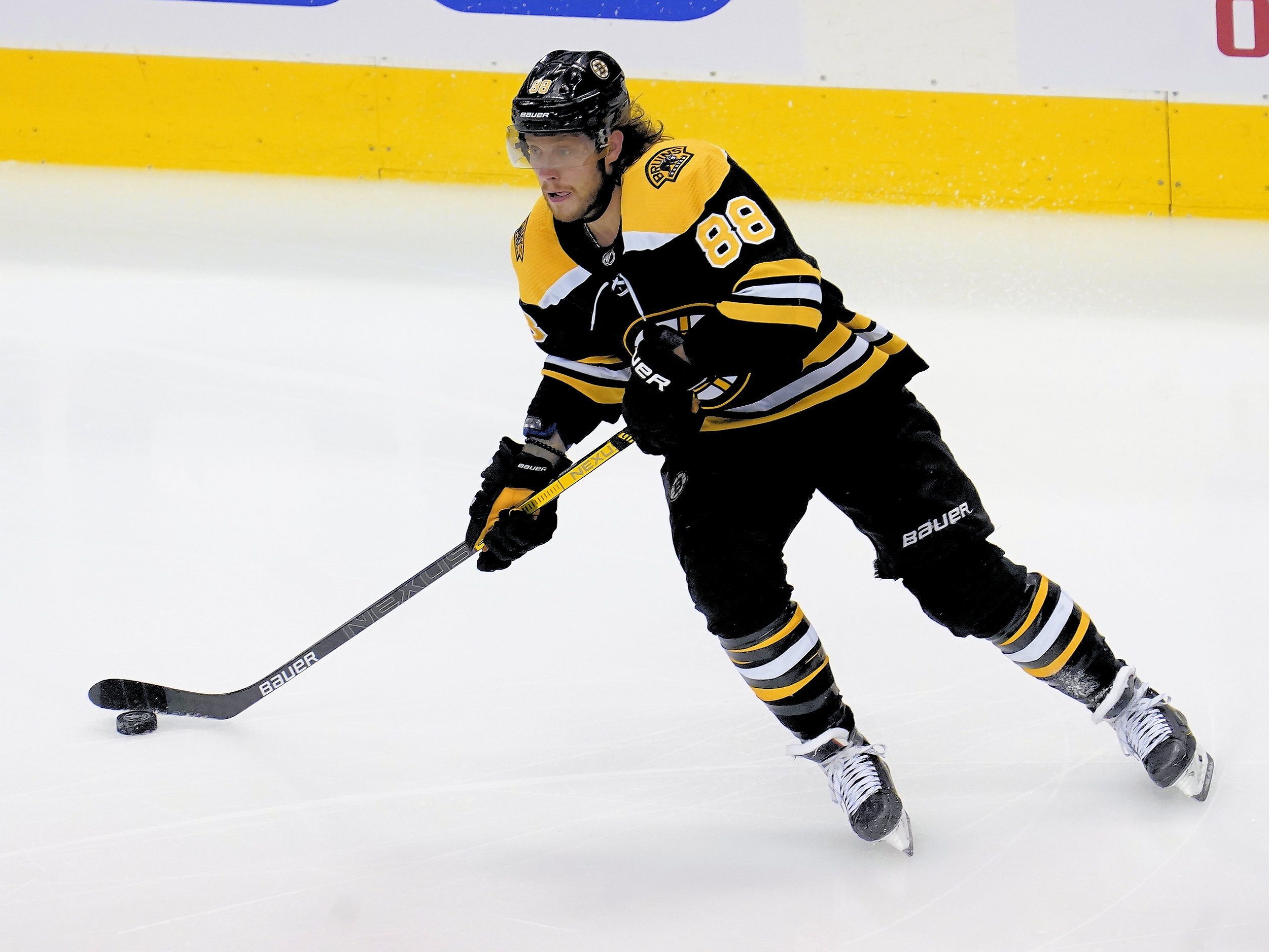 Aug 29, 2020; Toronto, Ontario, CAN; Boston Bruins forward David Pastrnak (88) passes the puck against the Tampa Bay Lightning in game four of the second round of the 2020 Stanley Cup Playoffs at Scotiabank Arena.