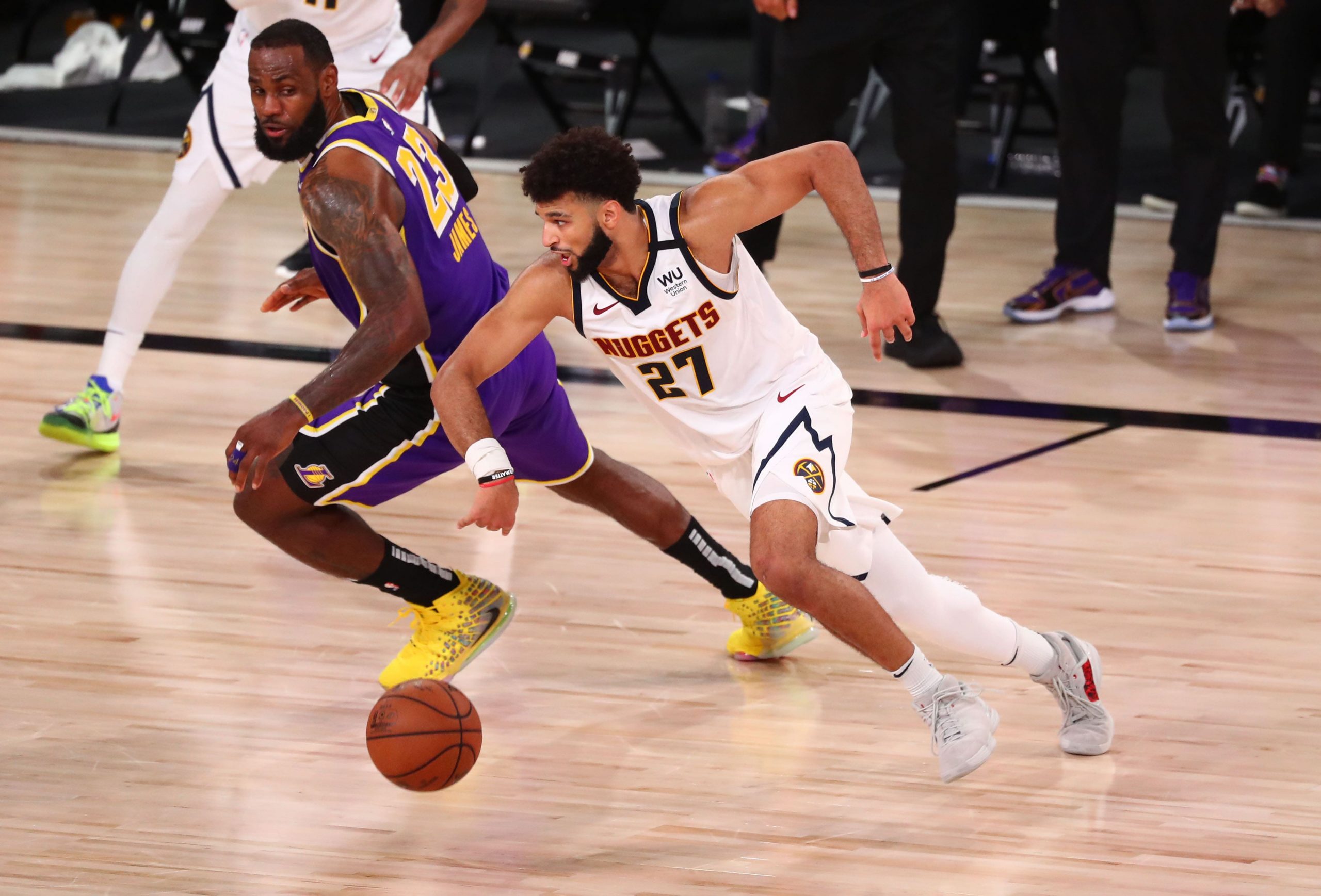 Denver Nuggets guard Jamal Murray dribbles against Los Angeles Lakers forward LeBron James during Western Conference Finals Game 5