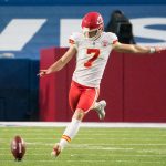 Kansas City Chiefs kicker Harrison Butker (7) sets for a kickoff against the Buffalo Bills in the second quarter at Bills Stadium.