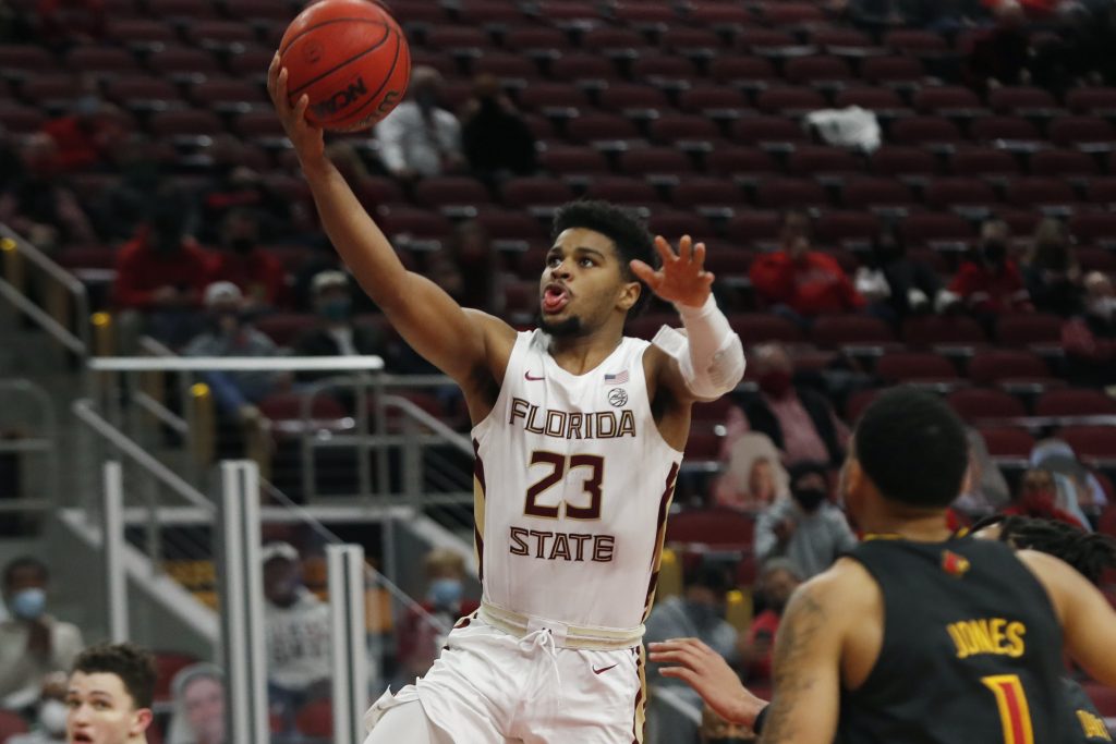 Florida State Seminoles guard MJ Walker (23) goes up for a shot against the Louisville Cardinal at KFC Yum! Center