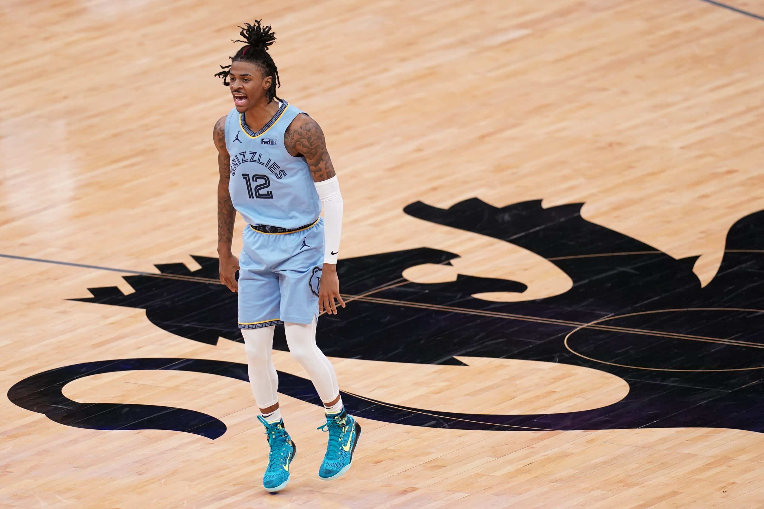 Memphis Grizzlies guard Ja Morant (12) reacts after the Grizzles scored a basket against the Sacramento Kings in the fourth quarter at the Golden 1 Center