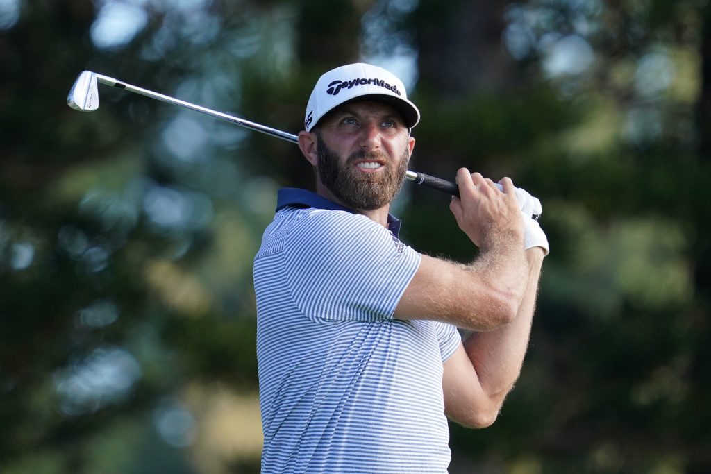 Dustin Johnson hits a tee shot on the second hole during the final round of the Sentry Tournament of Champions golf tournament at Kapalua Resort - The Plantation Course.