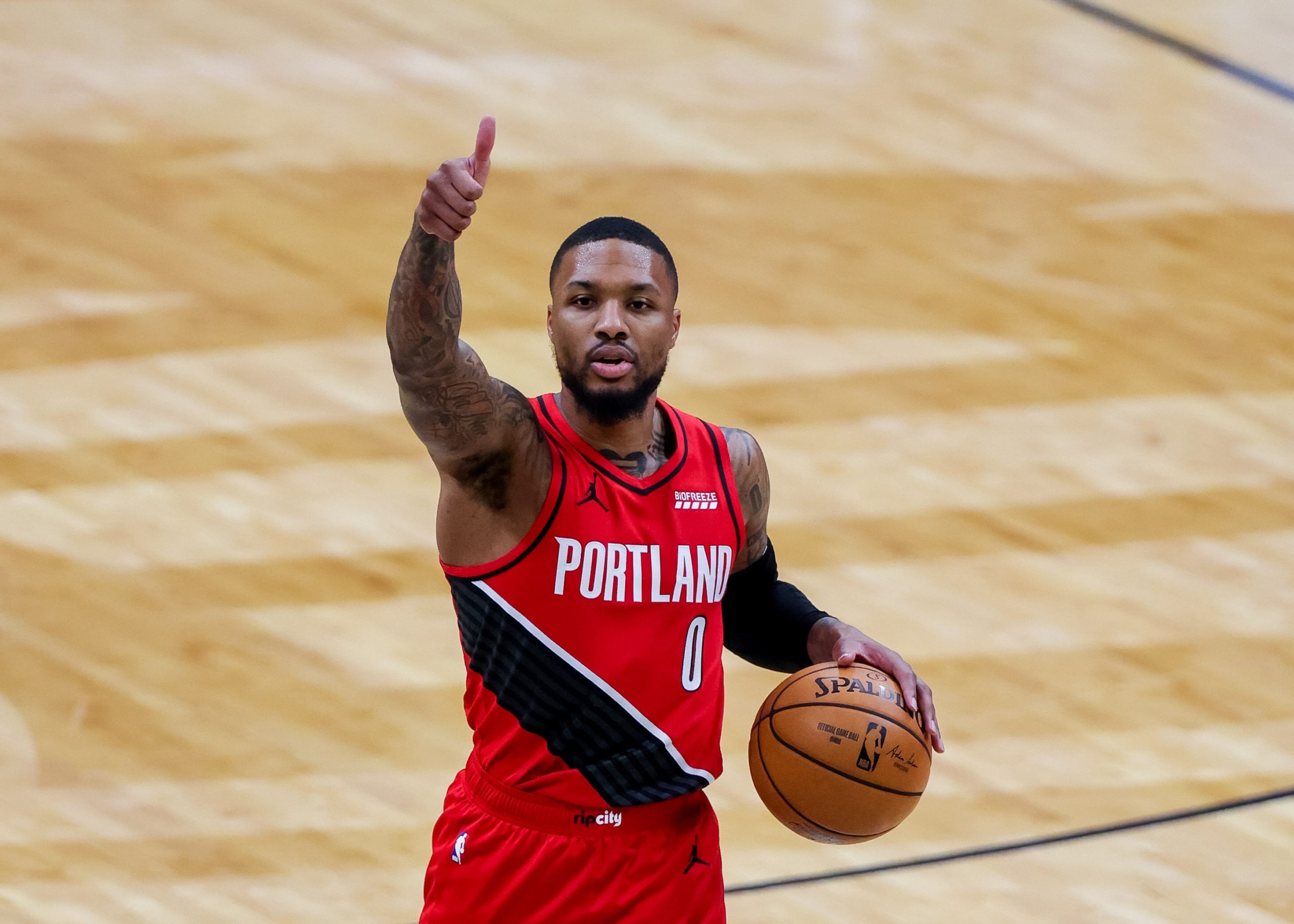 Feb 17, 2021; New Orleans, Louisiana, USA; Portland Trail Blazers guard Damian Lillard (0) calls a play against New Orleans Pelicans during the first half at the Smoothie King Center