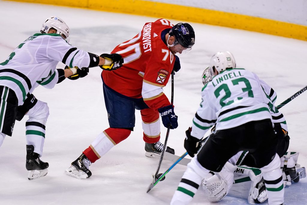 Florida Panthers Patric Hornqvist battles for the puck with Dallas Stars Esa Lindell