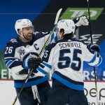 Feb 21, 2021; Vancouver, British Columbia, CAN; Winnipeg Jets forward Blake Wheeler (26) and forward Mark Scheifele (55) celebrate ScheifeleÕs goal against the Vancouver Canucks in the third period at Rogers Arena. Jets won 4-3 in Overtime.