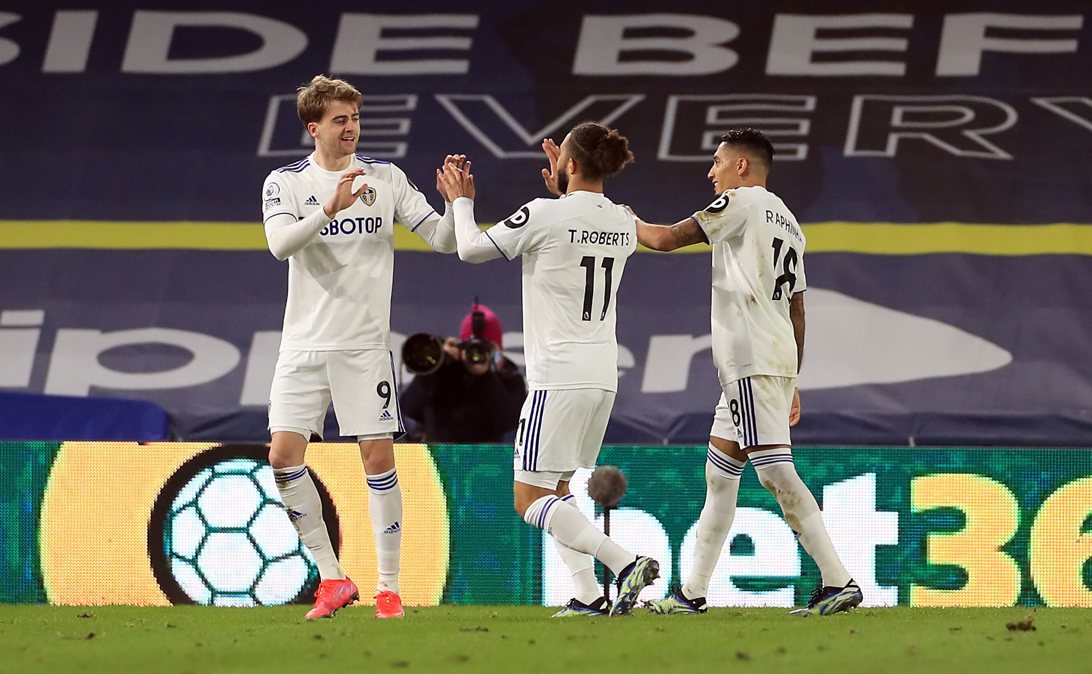 Leeds United's Patrick Bamford celebrates scoring their side's first goal of the game with team-mates during the Premier League match at Elland Road, Leeds.