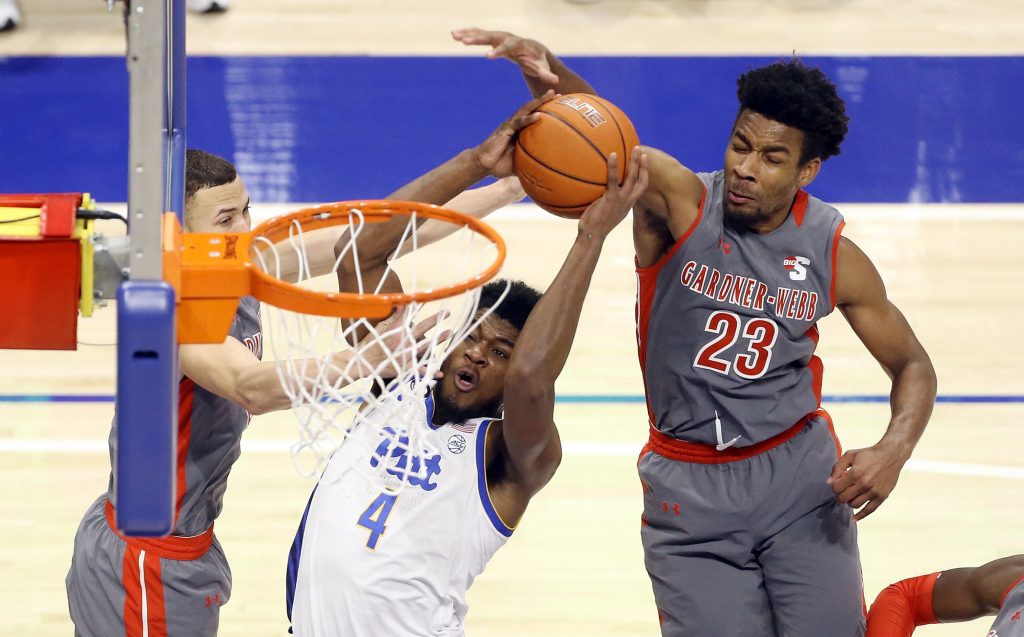 Pittsburgh Panthers guard Gerald Drumgoole Jr. (4) shoots against Gardner Webb Runnin Bulldogs guard Lance Terry (left) and guard Anthony Selden (23) during the second half at the Petersen Events Center.