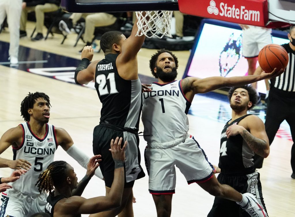 Connecticut Huskies guard R.J. Cole (1) drives to the basket against Providence Friars forward Ed Croswell (21) in the second half at Harry A. Gampel Pavilion. UConn won 73-61.