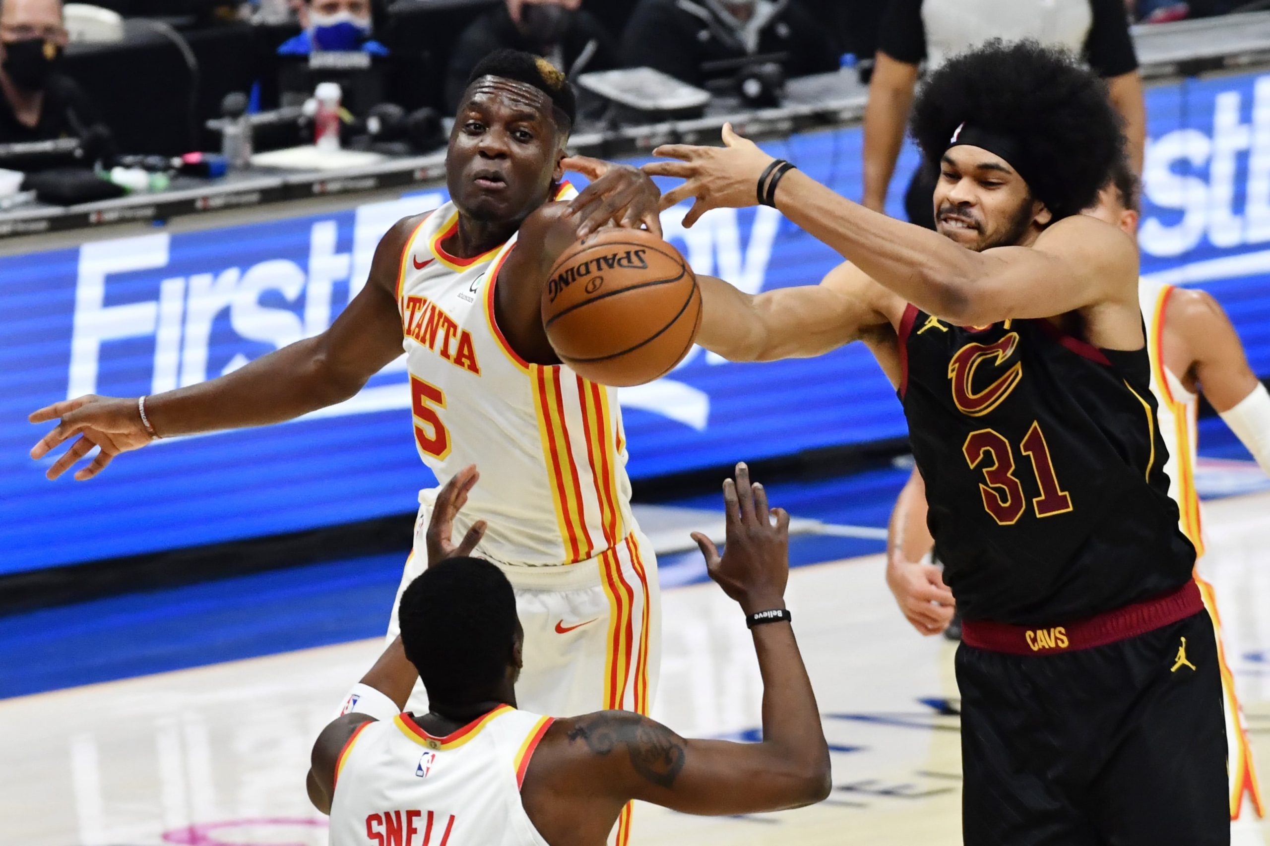 Cleveland Cavaliers center Jarrett Allen (31) goes for a rebound against Atlanta Hawks center Clint Capela (15) and guard Tony Snell (19) during the second quarter at Rocket Mortgage FieldHouse.
