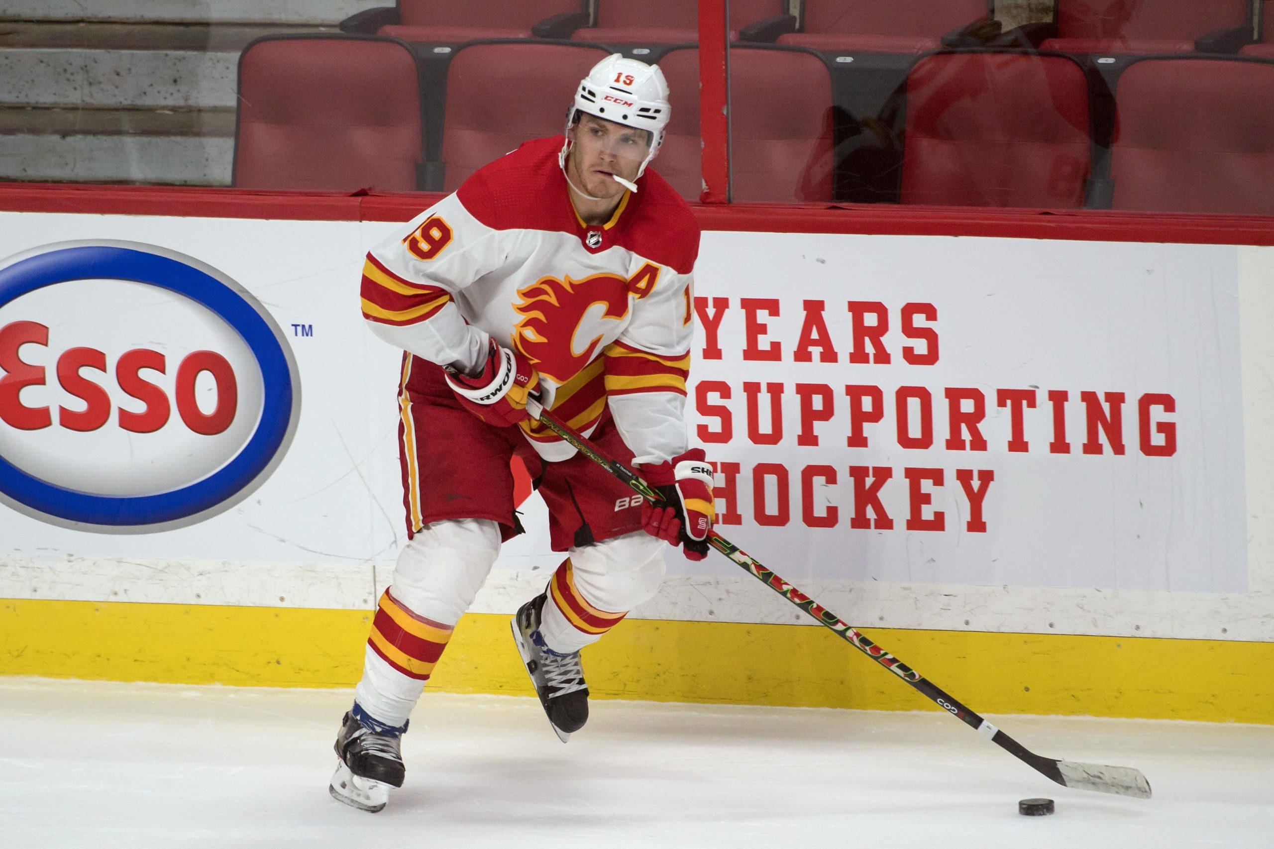 Calgary Flames left wing Matthew Tkachuk skates with puck.