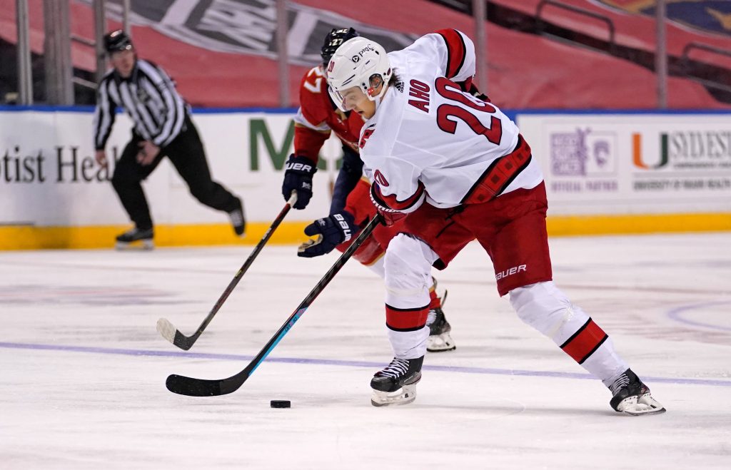 Mar 1, 2021; Sunrise, Florida, USA; Carolina Hurricanes right wing Sebastian Aho (20) controls the puck against the Florida Panthers during the first period at BB&T Center