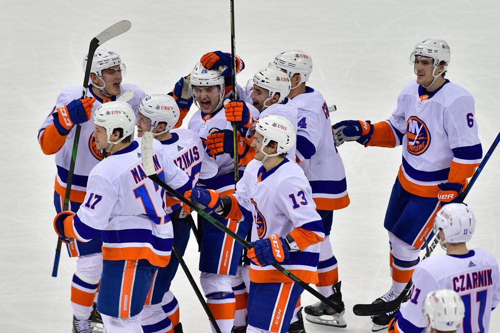 New York Islanders right wing Oliver Wahlstrom celebrates with teammates