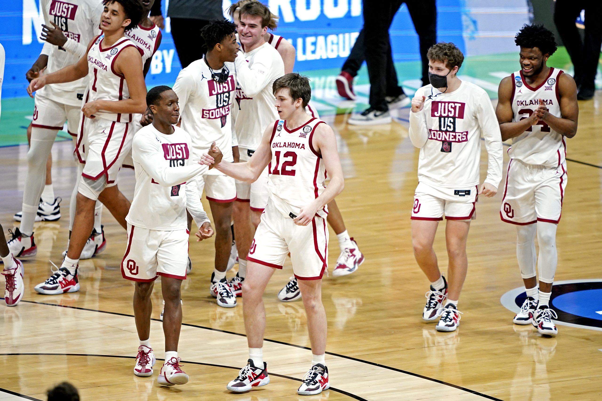 The Oklahoma Sooners celebrate after beating the Missouri Tigers in the first round of the 2021 NCAA Tournament at Lucas Oil Stadium.