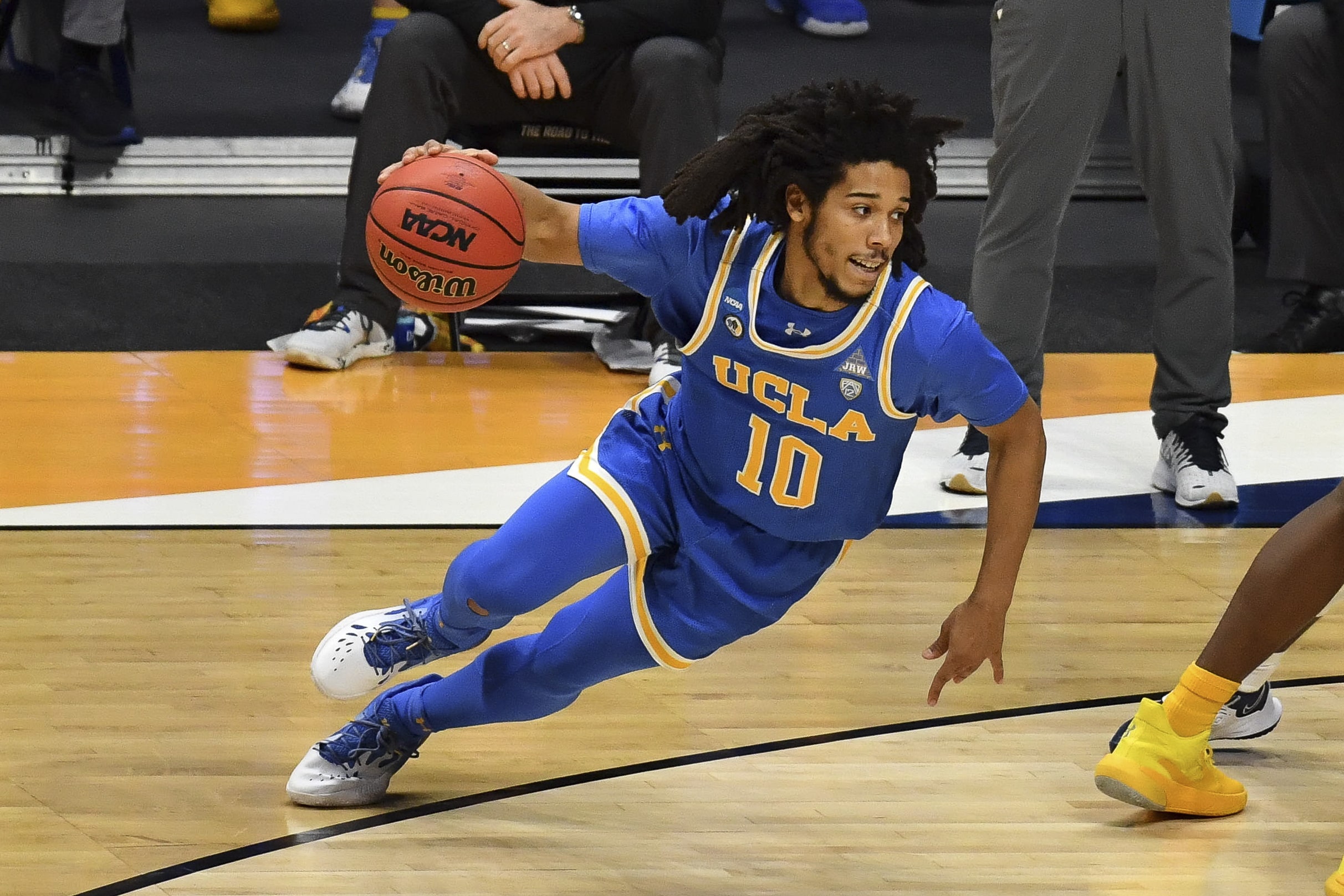 UCLA Bruins guard Tyger Campbell (10) dribbles the ball against the Brigham Young Cougars during the first round of the 2021 NCAA Tournament at Hinkle Fieldhouse