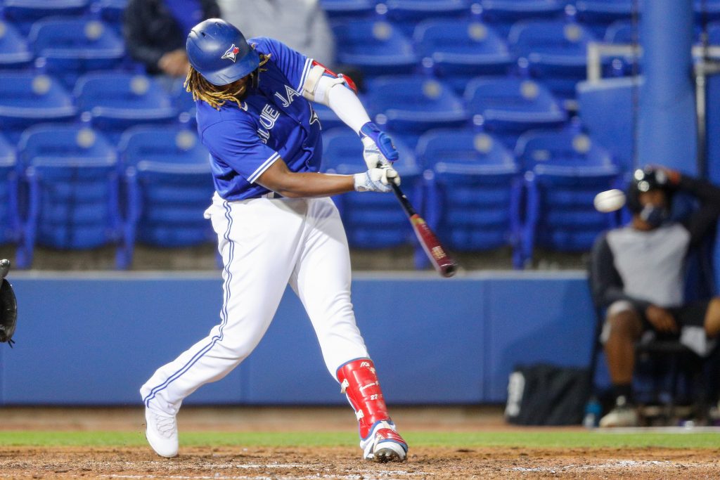 Toronto Blue Jays designated hitter Vladimir Guerrero Jr. (27) doubles in the sixth inning during spring training at TD Ballpark.