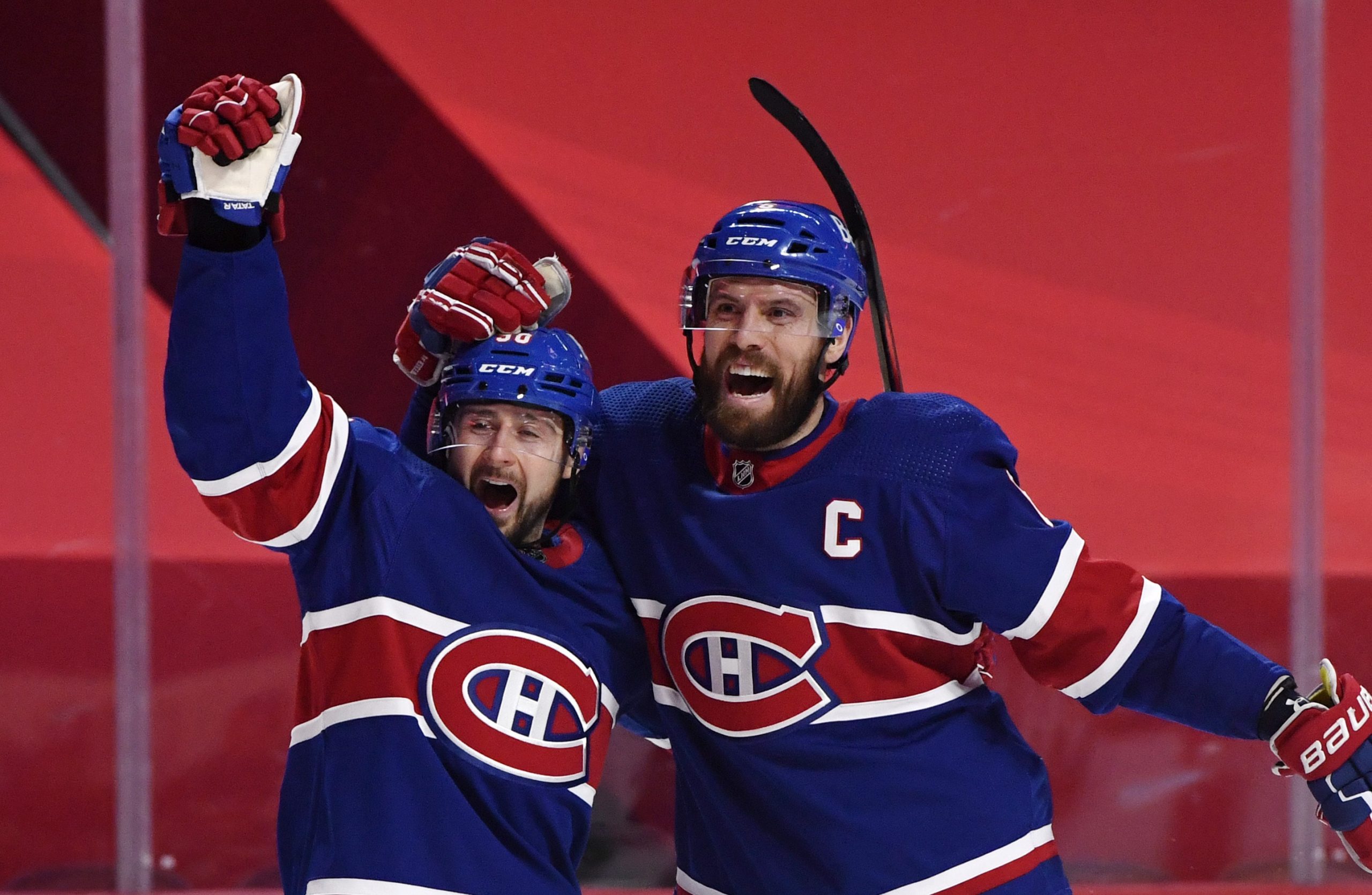 Montreal Canadiens forward Tomas Tatar reacts with teammate defenseman Shea Weber after scoring a goal