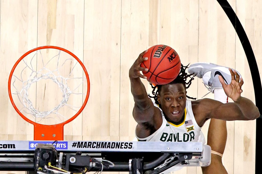 Baylor Bears forward Jonathan Tchamwa Tchatchoua (23) grabs a rebound during the second half against the Arkansas Razorbacks in the Elite Eight of the 2021 NCAA Tournament at Lucas Oil Stadium.