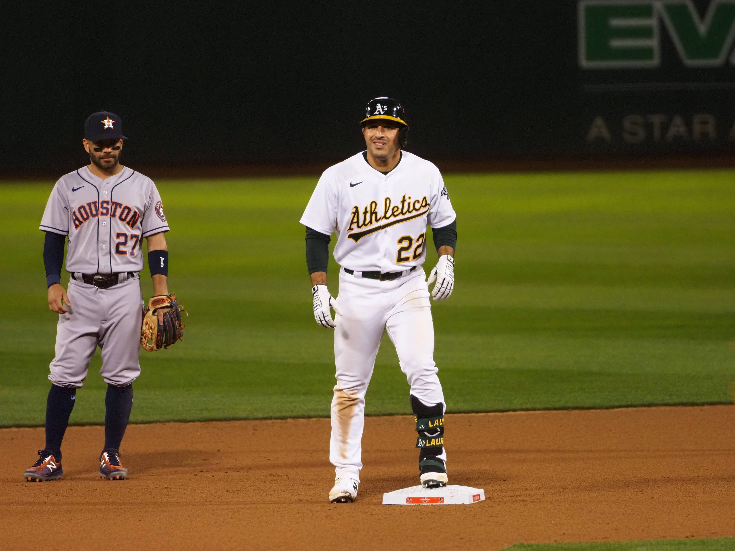 Oakland Athletics center fielder Ramon Laureano (22) on second base ahead of Houston Astros second baseman Jose Altuve (27) after hitting a double during the seventh inning at RingCentral Coliseum