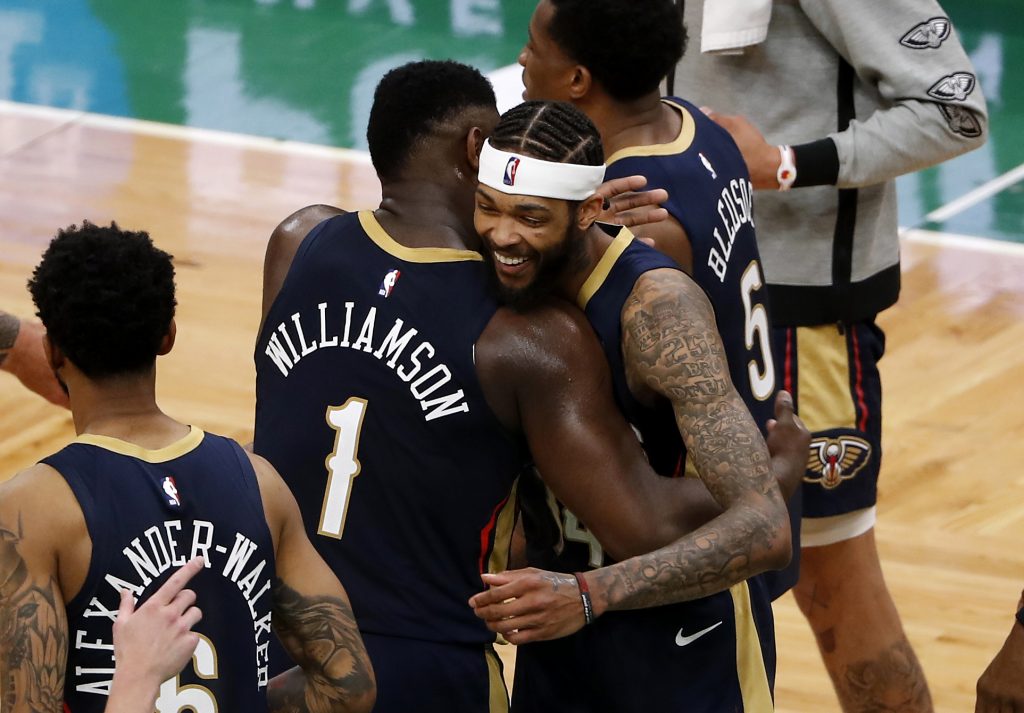 Zion Williamson hugging Brandon Ingram