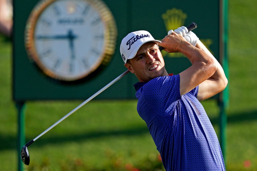 Justin Thomas plays his shot from the 18th tee during the final round of The Players Championship golf tournament at TPC Sawgrass - Stadium Course.