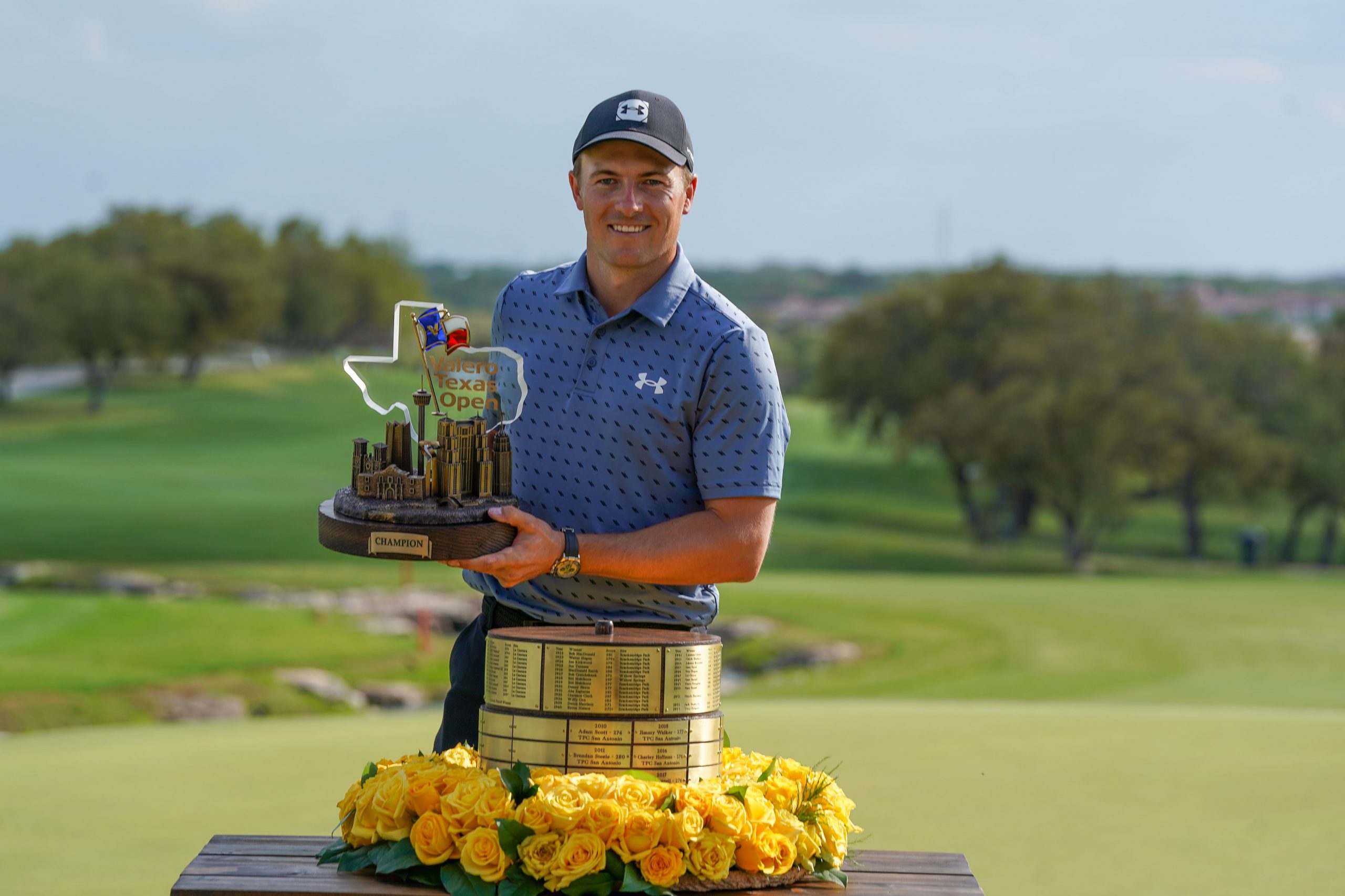 Jordan Spieth holds the trophy after winning the Valero Texas Open golf tou...