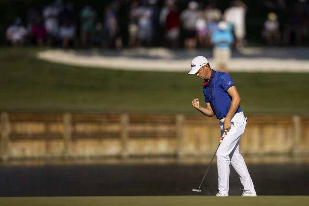 Justin Thomas reacts after sinking his putt on the 17th Green during the final round of The Players Championship at the Stadium Course at TPC Sawgrass on March 14, 2021 in Ponte Vedra Beach, Florida