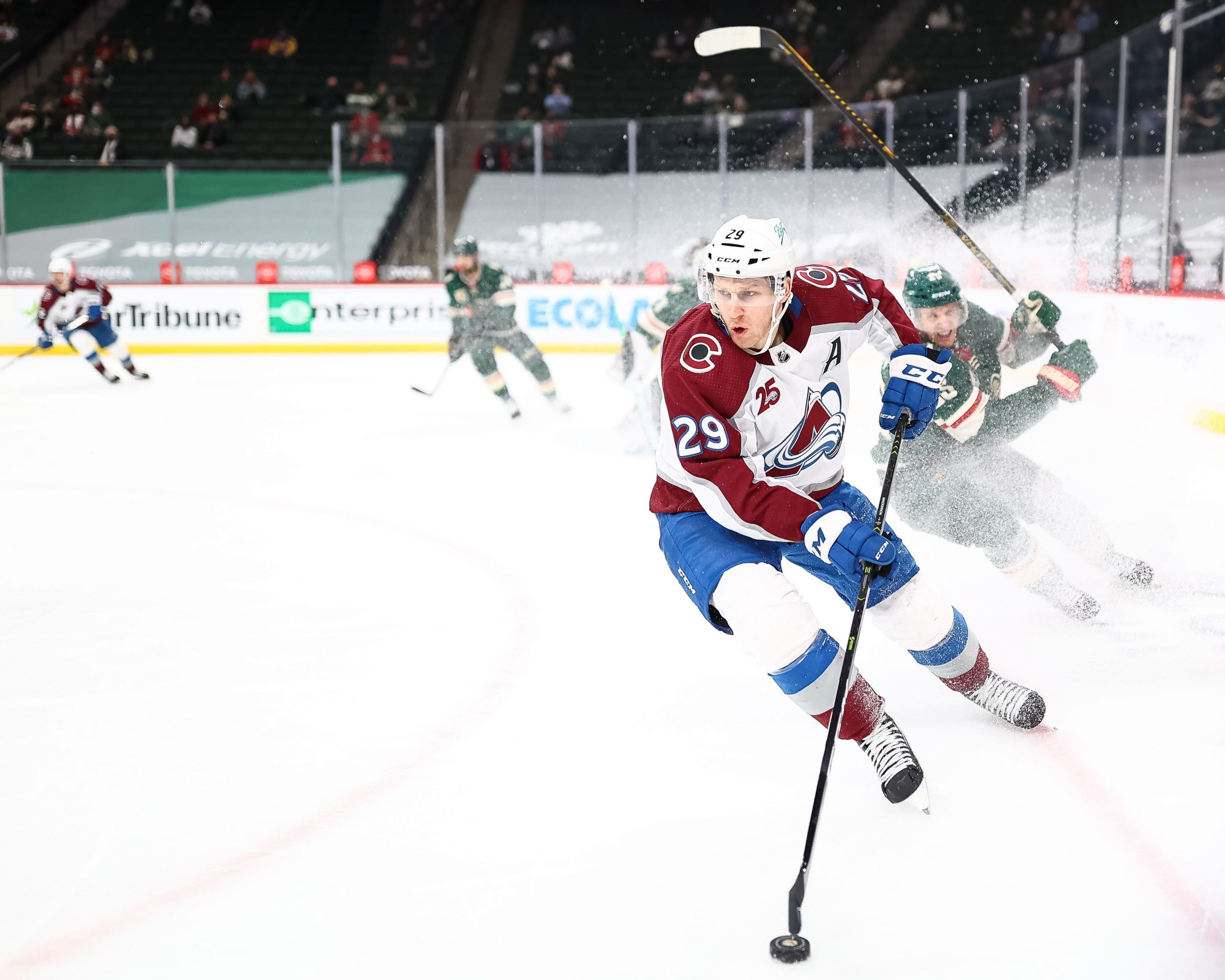 Colorado Avalanche center Nathan MacKinnon (29) skates with the puck during the third period against the Minnesota Wild.
