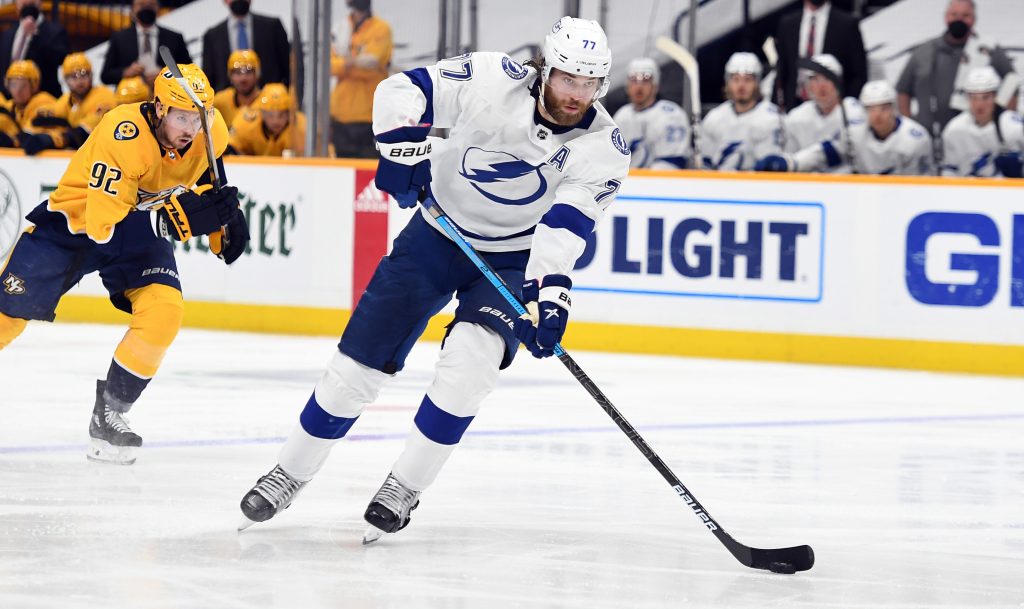 Apr 10, 2021; Nashville, Tennessee, USA; Tampa Bay Lightning defenseman Victor Hedman (77) passes the puck into the offensive zone against the Nashville Predators during the second period at Bridgestone Arena.